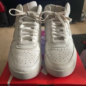 White mid top Nikes